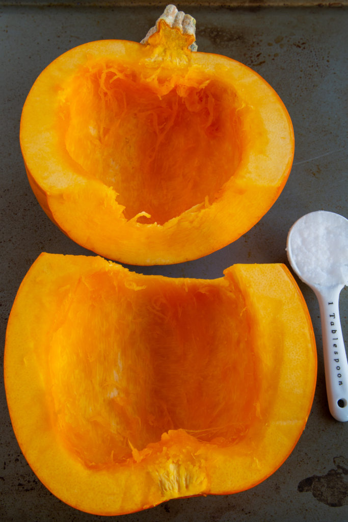 Preparing Cut Halves of Sugar Pumpkin to Bake