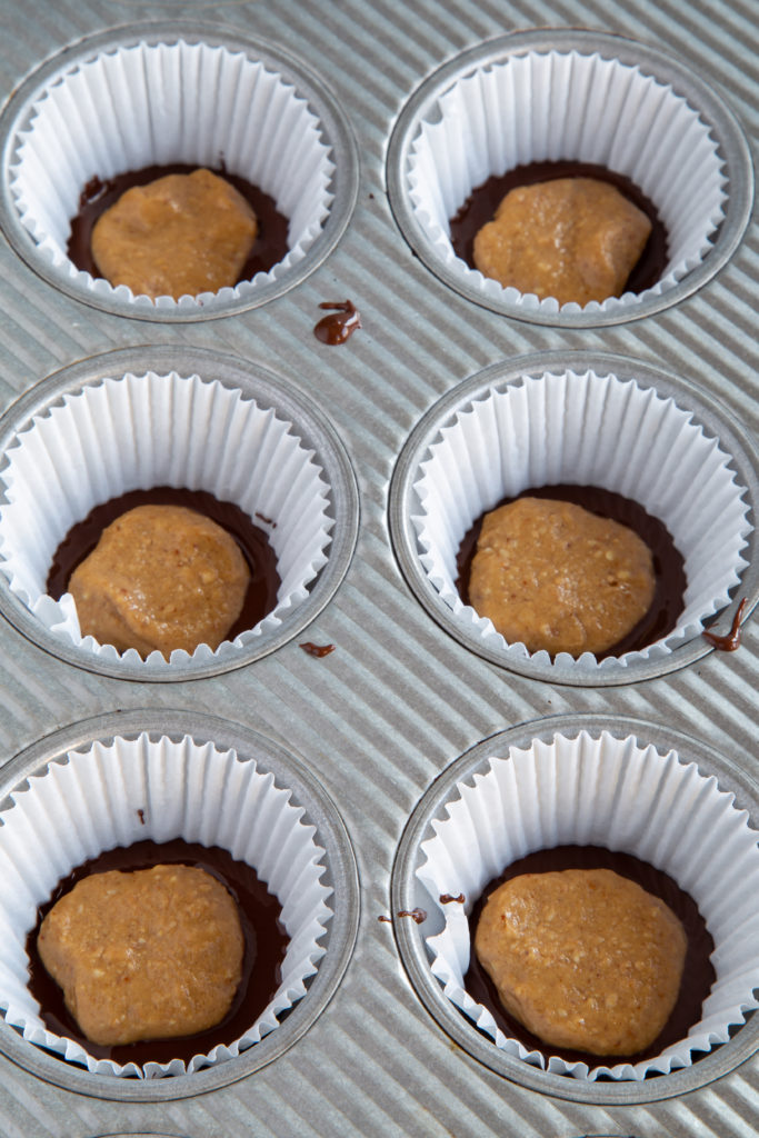 Chocolate and peanut butter filling placed together for Homemade Peanut Butter Cups