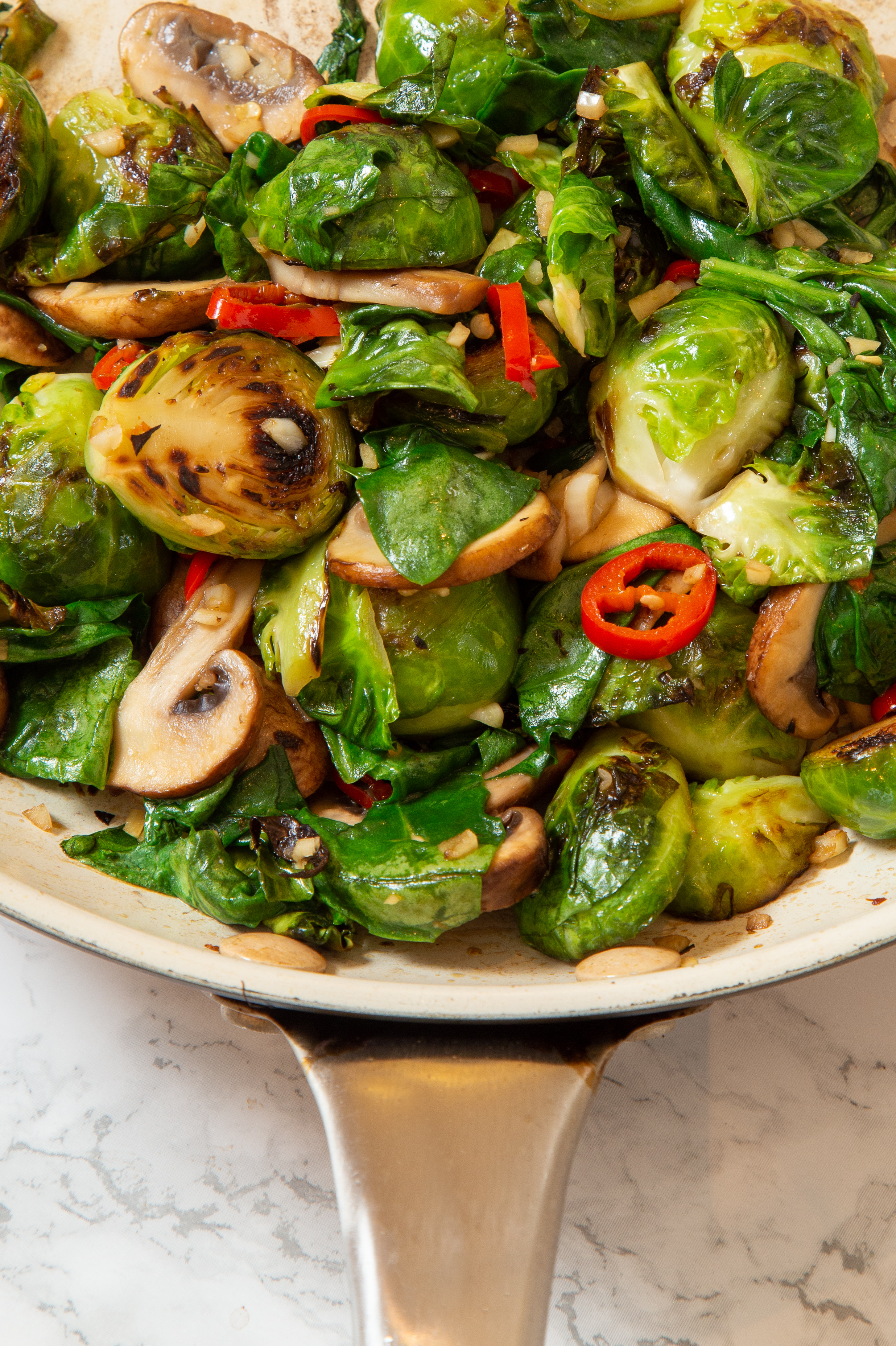 Sautéed brussells sprouts, mushrooms, chili, spinach, garlic, and shallot