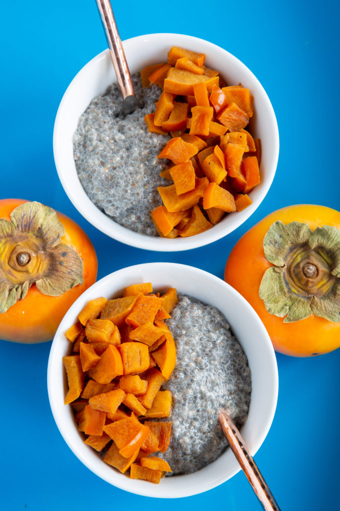 Overhead shot of two cups of Chia Yogurt with Caramelized Persimmons