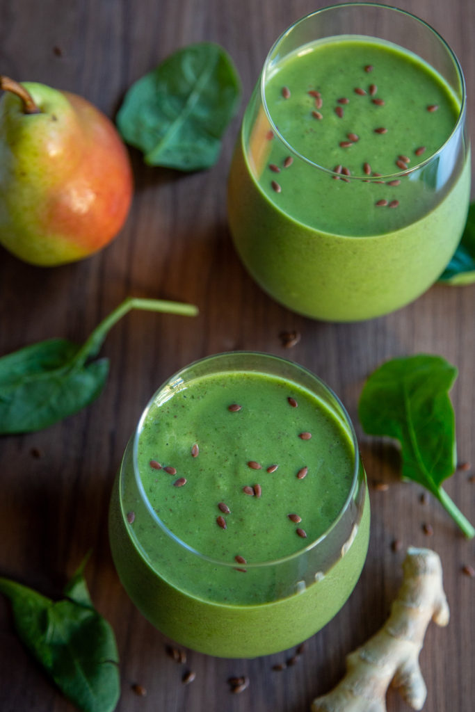 Overhead shot of two Ginger Pear Green Smoothies