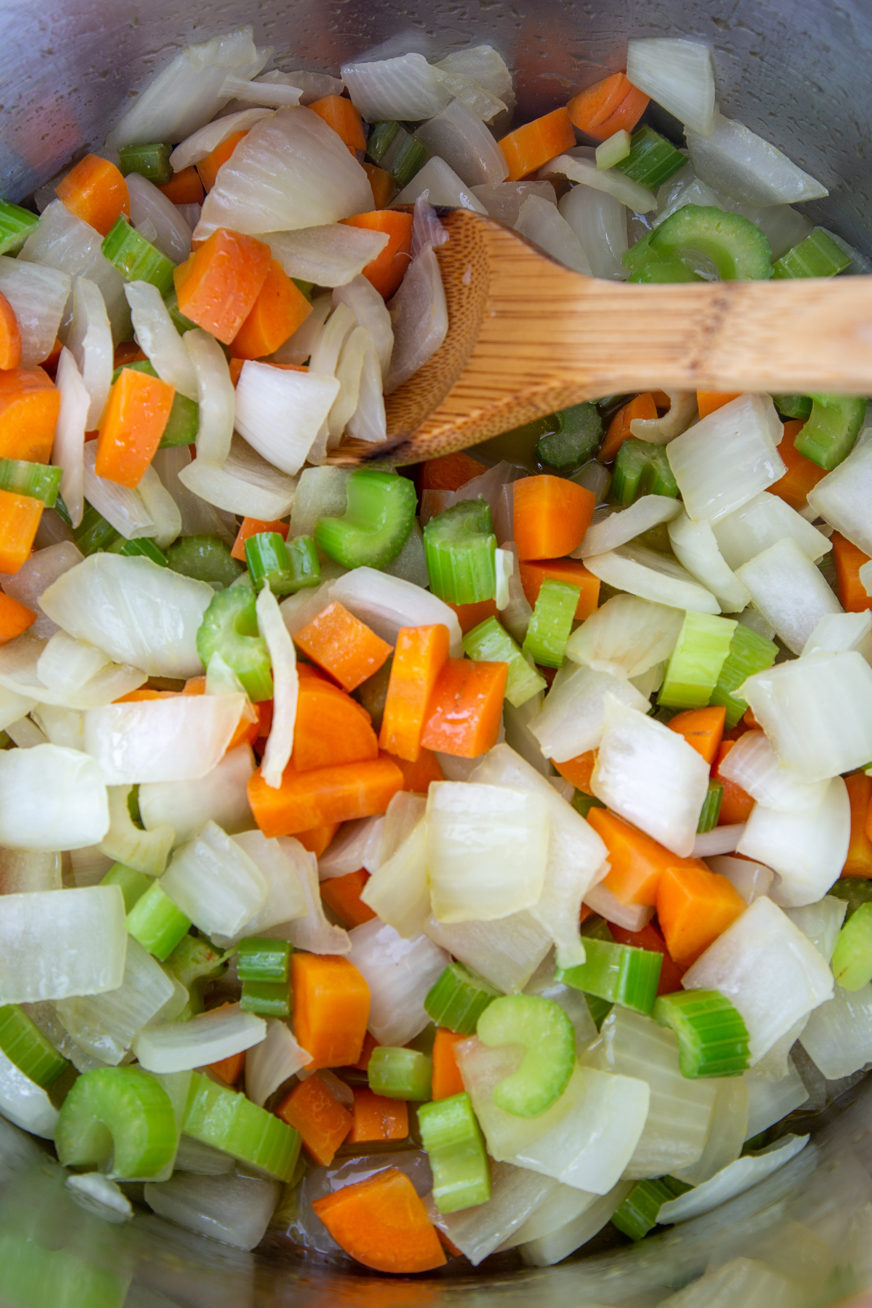 Carrots, onion, and celery chopped and cooked on low as a mirepoix for Holiday Vegan Stuffing (Dressing)