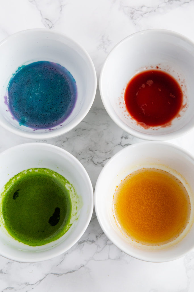 Purple, blue, red, green, and yellow natural food coloring