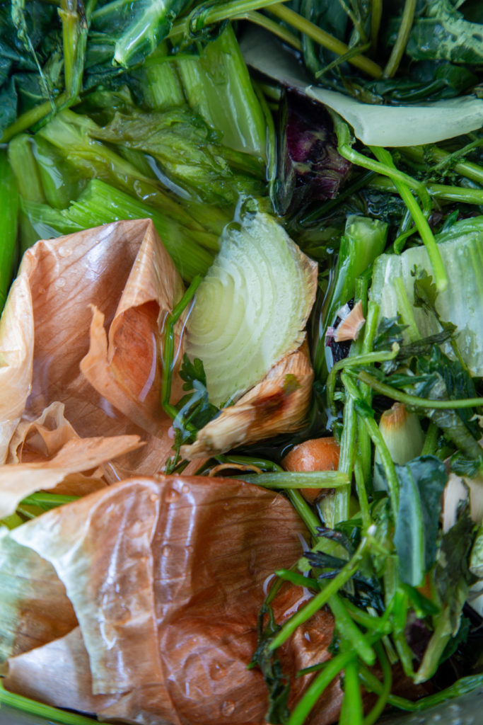 Vegetable and herbs in water ready to boil