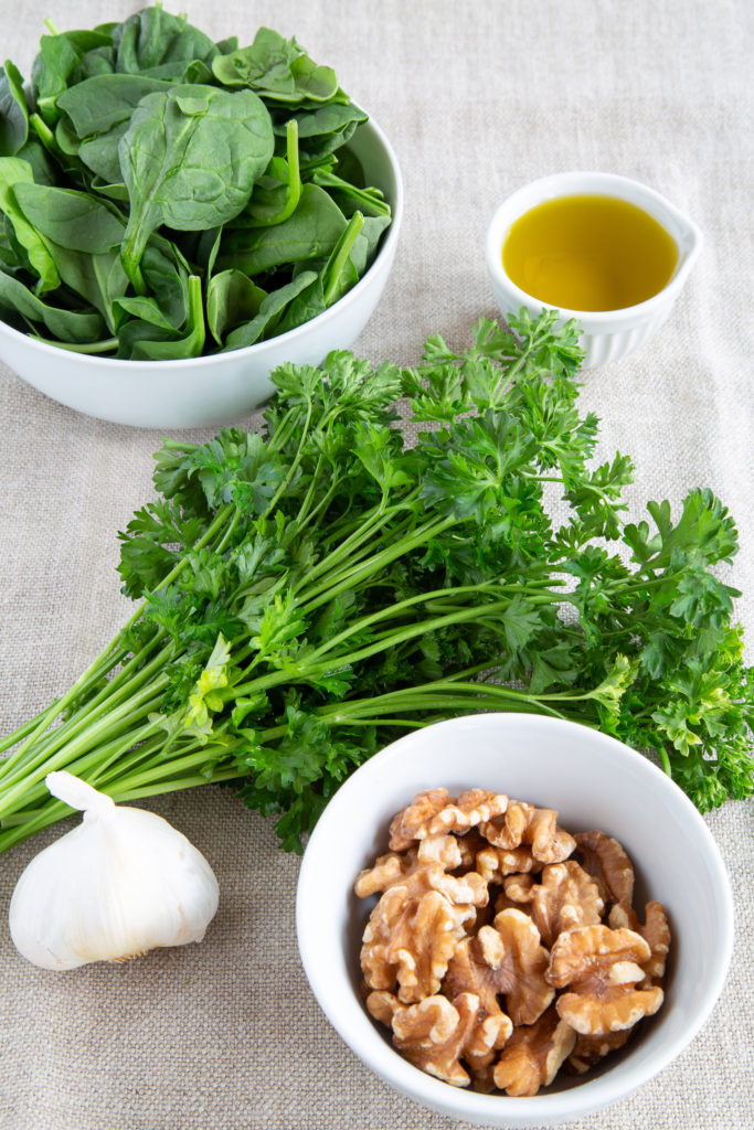 Spinach, parsley, walnuts, garlic, and olive oil for Winter Pesto