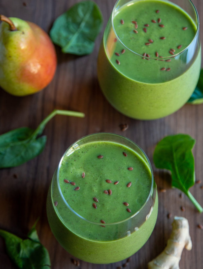 Overhead shot of two glasses of Ginger Pear Green Smoothie