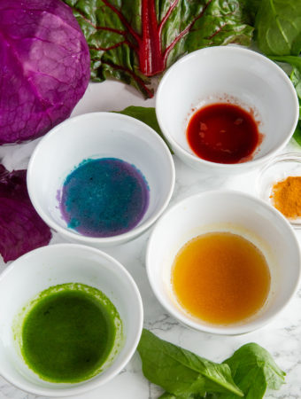 Natural Food Coloring surrounded by winter vegetable